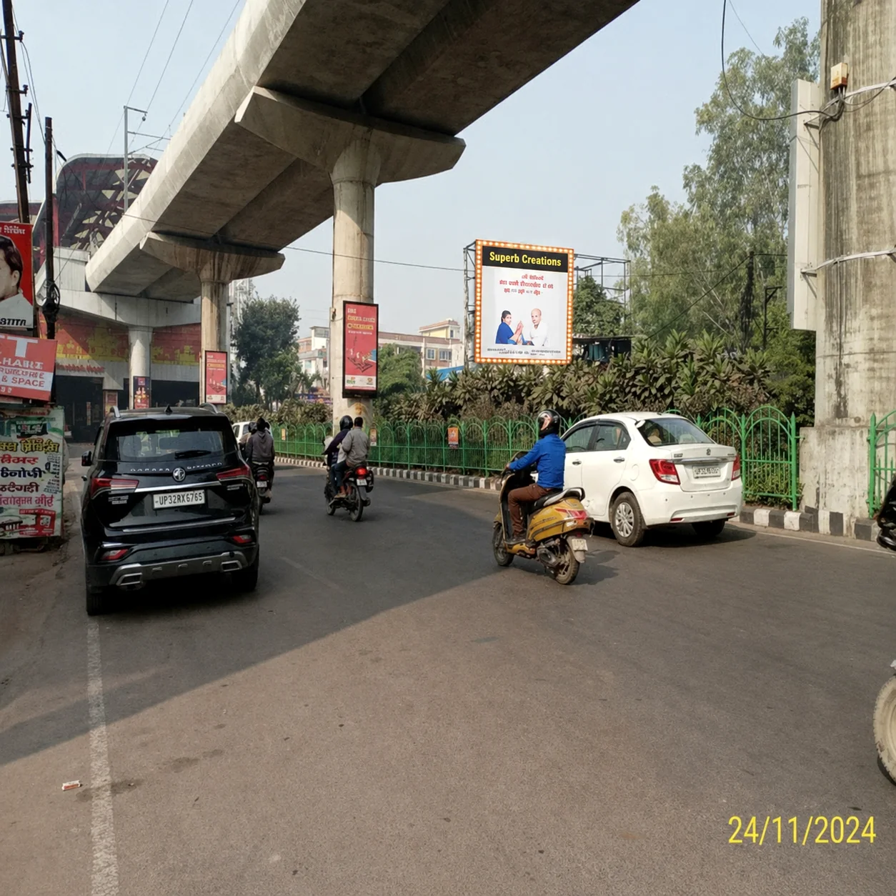 Roadside billboard under metro corridor in Lucknow
